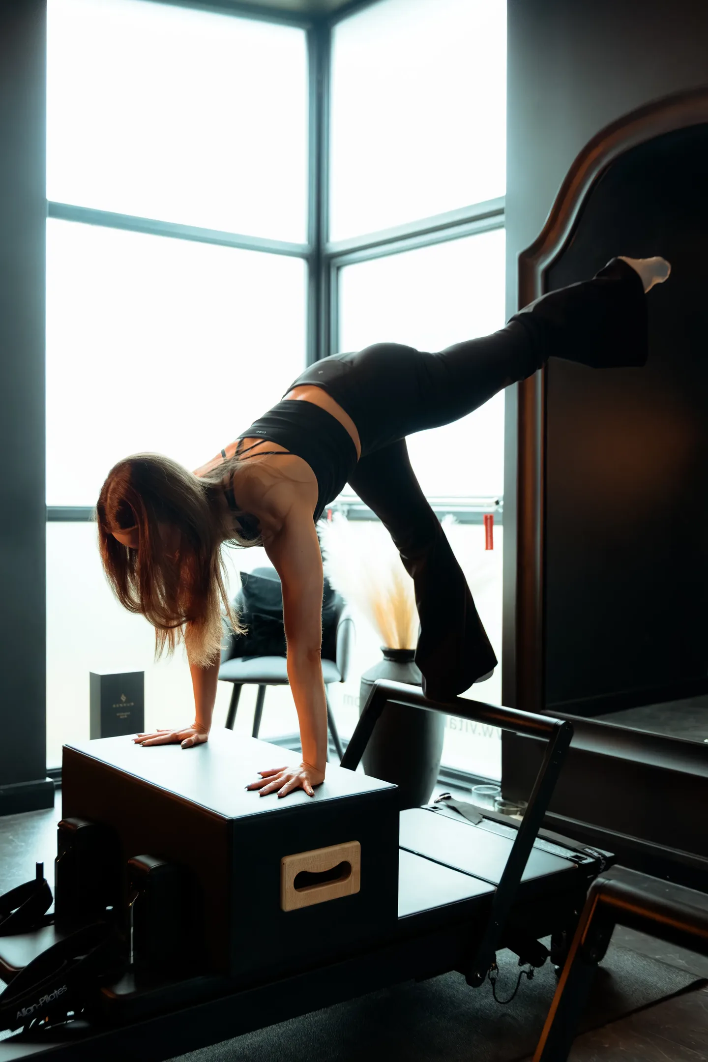 Kayla teaching a reformer Pilates class at Vitális Studios